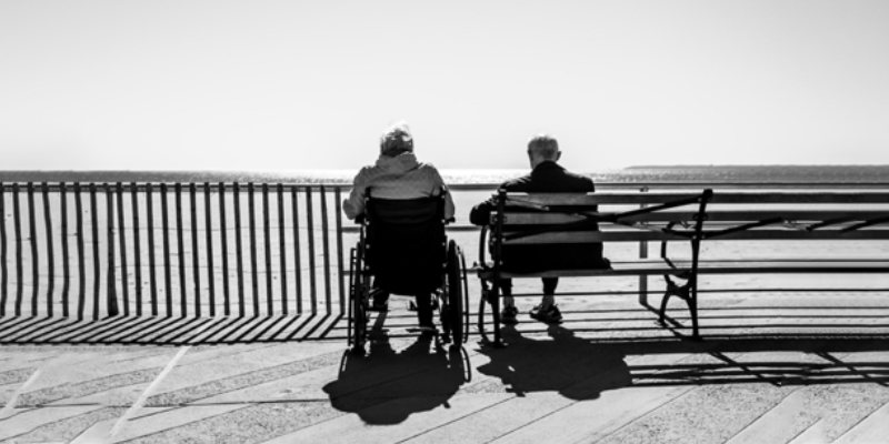 elderly man and woman sitting together