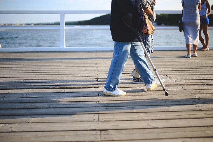 person walking with crutch