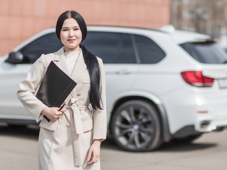 woman holding car insurance documents